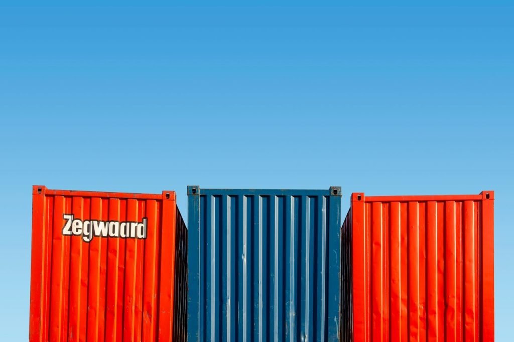 Colorful shipping containers under clear skies, perfect for logistic themes.